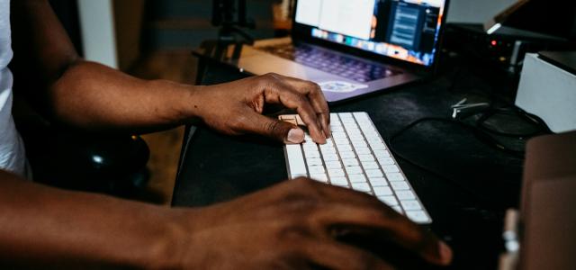 person using white and black laptop computer by Kit (formerly ConvertKit) courtesy of Unsplash.